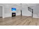 Bright living room with built-in shelving, a fireplace, and staircase, creating a cozy and inviting space at 2777 Oak Manor Dr, Mount Pleasant, SC 29466
