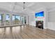 Bright living room with fireplace, built-in shelves, coffered ceilings, and expansive windows with water views at 2777 Oak Manor Dr, Mount Pleasant, SC 29466