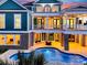 Stunning backyard with a blue pool, outdoor fire pit, and multi-level balconies at 2777 Oak Manor Dr, Mount Pleasant, SC 29466