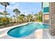 Captivating pool with lush landscaping and wrought iron fence, offering a serene waterfront backdrop at 2777 Oak Manor Dr, Mount Pleasant, SC 29466