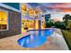 Captivating pool area with brick detailing, lush greenery, and ambient lighting for luxurious outdoor enjoyment at 2777 Oak Manor Dr, Mount Pleasant, SC 29466