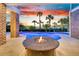 Inviting pool area featuring a modern fire pit and elegant brick accents at 2777 Oak Manor Dr, Mount Pleasant, SC 29466