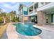 Beautiful pool area with manicured landscaping, an outdoor fire pit and direct access to indoor living spaces at 2777 Oak Manor Dr, Mount Pleasant, SC 29466