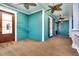 Inviting porch featuring a ceiling fan, wooden floors, and a colorful wall, perfect for relaxation at 2777 Oak Manor Dr, Mount Pleasant, SC 29466
