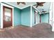 Inviting porch featuring a ceiling fan, wooden floors, and a colorful wall, perfect for relaxation at 2777 Oak Manor Dr, Mount Pleasant, SC 29466