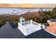Rooftop deck with views of the waterway beyond palm trees and marshland at 2777 Oak Manor Dr, Mount Pleasant, SC 29466