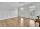 Bright open room with hardwood floors, large windows and white wainscoting that fills the room with natural light at 2777 Oak Manor Dr, Mount Pleasant, SC 29466