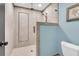 Close-up of a tiled shower with glass door and light blue wall, showcasing modern fixtures at 2777 Oak Manor Dr, Mount Pleasant, SC 29466