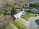 An aerial view showing a home with a metal roof, and a long driveway on a well maintained lot at 305 Meadowlark Ln, Moncks Corner, SC 29461