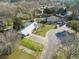 An aerial view showing a home with a metal roof, and a long driveway on a well maintained lot at 305 Meadowlark Ln, Moncks Corner, SC 29461