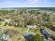 An aerial view of a charming waterfront neighborhood with lush greenery and lake views at 305 Meadowlark Ln, Moncks Corner, SC 29461