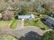 An aerial view of a home with fenced backyard, long driveway, and well maintained front lawn at 305 Meadowlark Ln, Moncks Corner, SC 29461