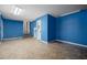 Spacious blue-walled basement area with easy access to the upper levels at 305 Meadowlark Ln, Moncks Corner, SC 29461