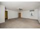 Spacious bedroom with neutral colored carpet, large window, and a ceiling fan at 305 Meadowlark Ln, Moncks Corner, SC 29461
