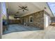 Large covered area with ceiling fans, providing ample space for parking and storage at 305 Meadowlark Ln, Moncks Corner, SC 29461