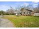 Charming brick home with a well-maintained lawn and mature trees at 305 Meadowlark Ln, Moncks Corner, SC 29461