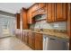 Well-appointed kitchen area with wood cabinets, granite countertops, and stainless steel appliances at 305 Meadowlark Ln, Moncks Corner, SC 29461
