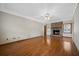 Bright living room with wood floors and a brick fireplace, perfect for cozy evenings at 305 Meadowlark Ln, Moncks Corner, SC 29461