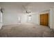 Spacious main bedroom with a ceiling fan, a closet, and a bathroom at 305 Meadowlark Ln, Moncks Corner, SC 29461