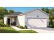 Charming single-story home featuring a manicured lawn and a two-car garage at 314 Tiliwa St, Summerville, SC 29486