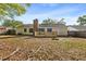 Home backyard with wooden deck and mature trees at 317 Commons Way, Goose Creek, SC 29445