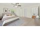 Staged bedroom with bed, rug and natural light from a window at 317 Commons Way, Goose Creek, SC 29445