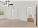 Bright bedroom featuring a ceiling fan and neutral carpeting at 317 Commons Way, Goose Creek, SC 29445