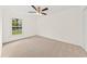 Bright bedroom with a window and light colored carpet at 317 Commons Way, Goose Creek, SC 29445