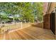 Wooden deck with railings surrounded by trees at 317 Commons Way, Goose Creek, SC 29445