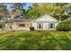 Traditional home with well-manicured front yard and charming curb appeal at 317 Commons Way, Goose Creek, SC 29445