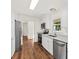 Kitchen features stainless appliances, light countertops, and white cabinetry at 317 Commons Way, Goose Creek, SC 29445