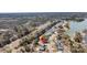 This aerial view showcases the home's position in a neighborhood by the pond at 3199 Great Egret Dr, Johns Island, SC 29455
