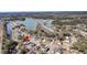Scenic aerial view of a neighborhood with homes surrounding a beautiful lake and lush greenery at 3199 Great Egret Dr, Johns Island, SC 29455