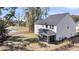 A screened-in porch and black metal fence highlight the backyard of this traditional two-story home at 3199 Great Egret Dr, Johns Island, SC 29455