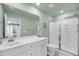 Well-lit bathroom featuring a glass-enclosed shower, a neutral color palette, and a large mirror at 3199 Great Egret Dr, Johns Island, SC 29455