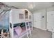Stylish bedroom with a unique treehouse-themed bunk bed and tree themed wallpaper at 3199 Great Egret Dr, Johns Island, SC 29455