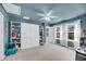 Large ' room with built-in shelves and storage, a ceiling fan, and natural light from the windows at 3199 Great Egret Dr, Johns Island, SC 29455