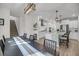 Open concept dining area next to kitchen with modern lighting and seating at 3199 Great Egret Dr, Johns Island, SC 29455