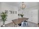 Dining room featuring a table with seating for six, a decorative chandelier and white built-ins at 3199 Great Egret Dr, Johns Island, SC 29455