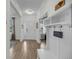 Inviting entryway featuring beautiful floors, a coat rack, and a view into other rooms at 3199 Great Egret Dr, Johns Island, SC 29455