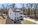 A charming two-story home boasts a balcony and well-manicured landscaping at 3199 Great Egret Dr, Johns Island, SC 29455