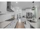Bright, modern kitchen with white cabinets, stainless steel appliances, and quartz countertops at 3199 Great Egret Dr, Johns Island, SC 29455