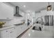 Bright, modern kitchen with white cabinets, stainless steel appliances, and quartz countertops at 3199 Great Egret Dr, Johns Island, SC 29455