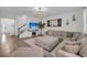 Cozy living room with large sectional sofa, decorative fireplace, and natural light at 3199 Great Egret Dr, Johns Island, SC 29455