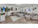 Spacious living room with large sectional sofa, area rug, and natural light at 3199 Great Egret Dr, Johns Island, SC 29455