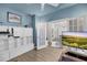 Home office with built-in cabinets, white french doors, and views of the kitchen and dining room at 3199 Great Egret Dr, Johns Island, SC 29455