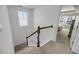Bright staircase with natural light and white railings leads to the second floor bedrooms at 3199 Great Egret Dr, Johns Island, SC 29455