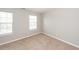 Cozy bedroom with two windows for natural light and neutral carpet at 3529 Galaxy Rd, Ladson, SC 29456