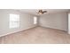 Spacious bedroom featuring neutral carpet, fan, and natural light at 3529 Galaxy Rd, Ladson, SC 29456