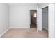 Neutral bedroom featuring soft carpet and a convenient closet at 3529 Galaxy Rd, Ladson, SC 29456